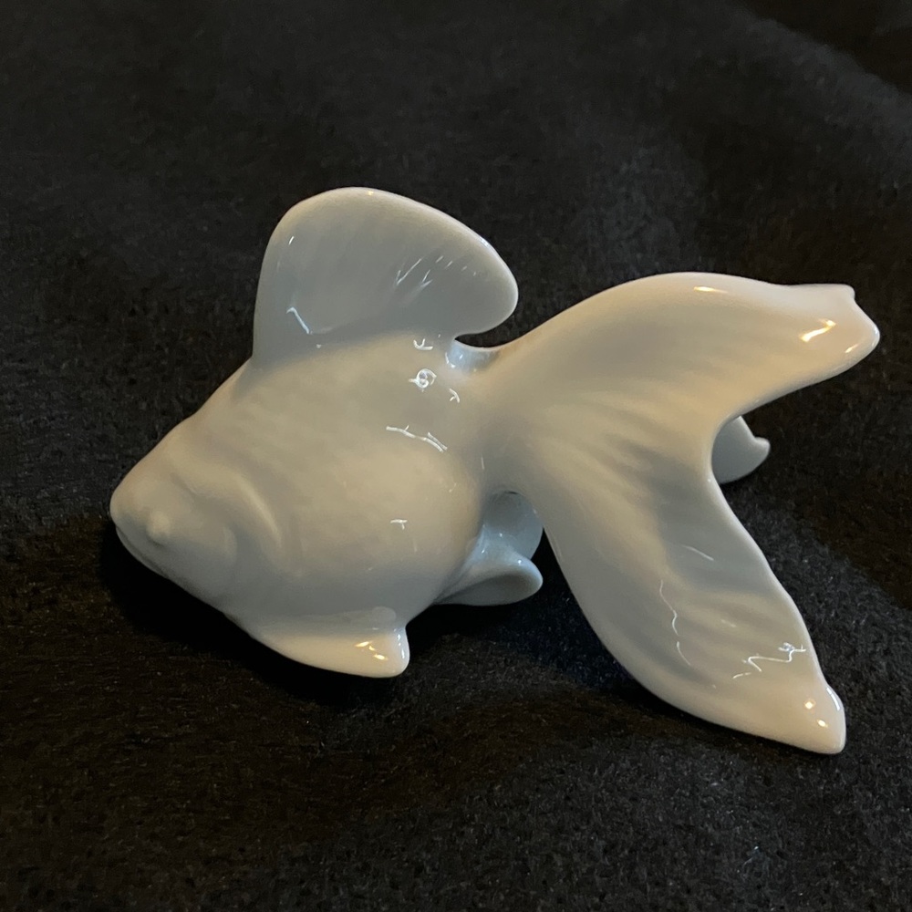White ceramic Coi figurine
